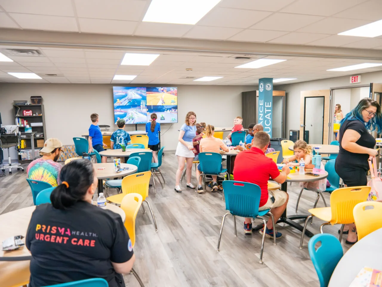 Students and families engaging in activities at Heron Virtual Academy's learning lab, fostering community.