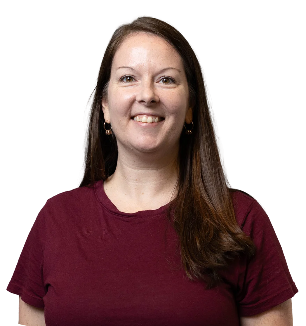 Smiling woman with long brown hair in a maroon shirt, representing Hill supports for students in cyber and virtual academies.